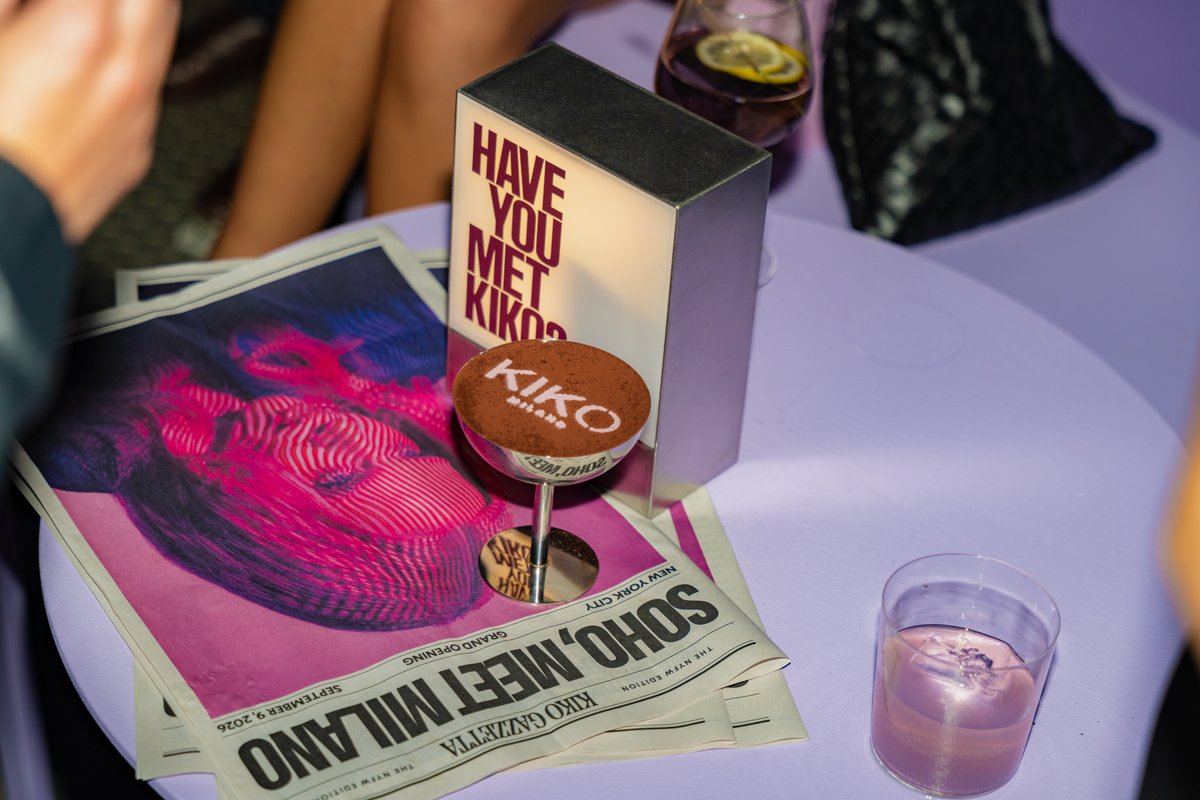 A close-up shot of a table featuring two drinks, one with "KIKO Milano" branding on its foam top, and another with a lem