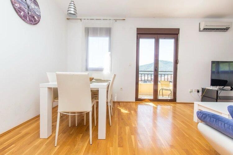 Two-Bedroom Apartment with Sea View in Podmaine District 9
