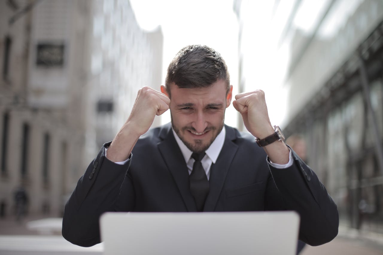 Man in Black Suit Achieved an Accomplishment. Photo by Andrea Piacquadio from pexels.com
