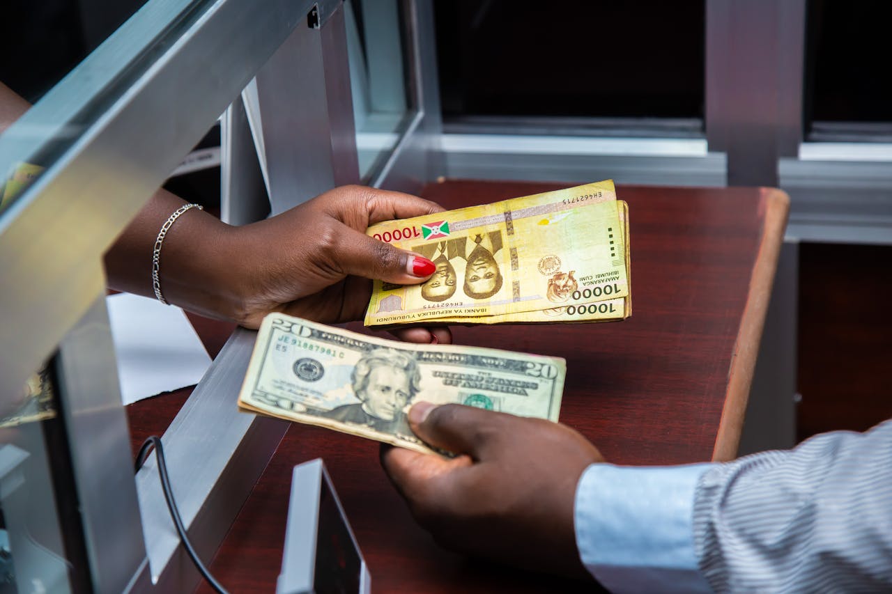 People Exchanging Money in Cantor. Photo by Andy of Course from pexels.com