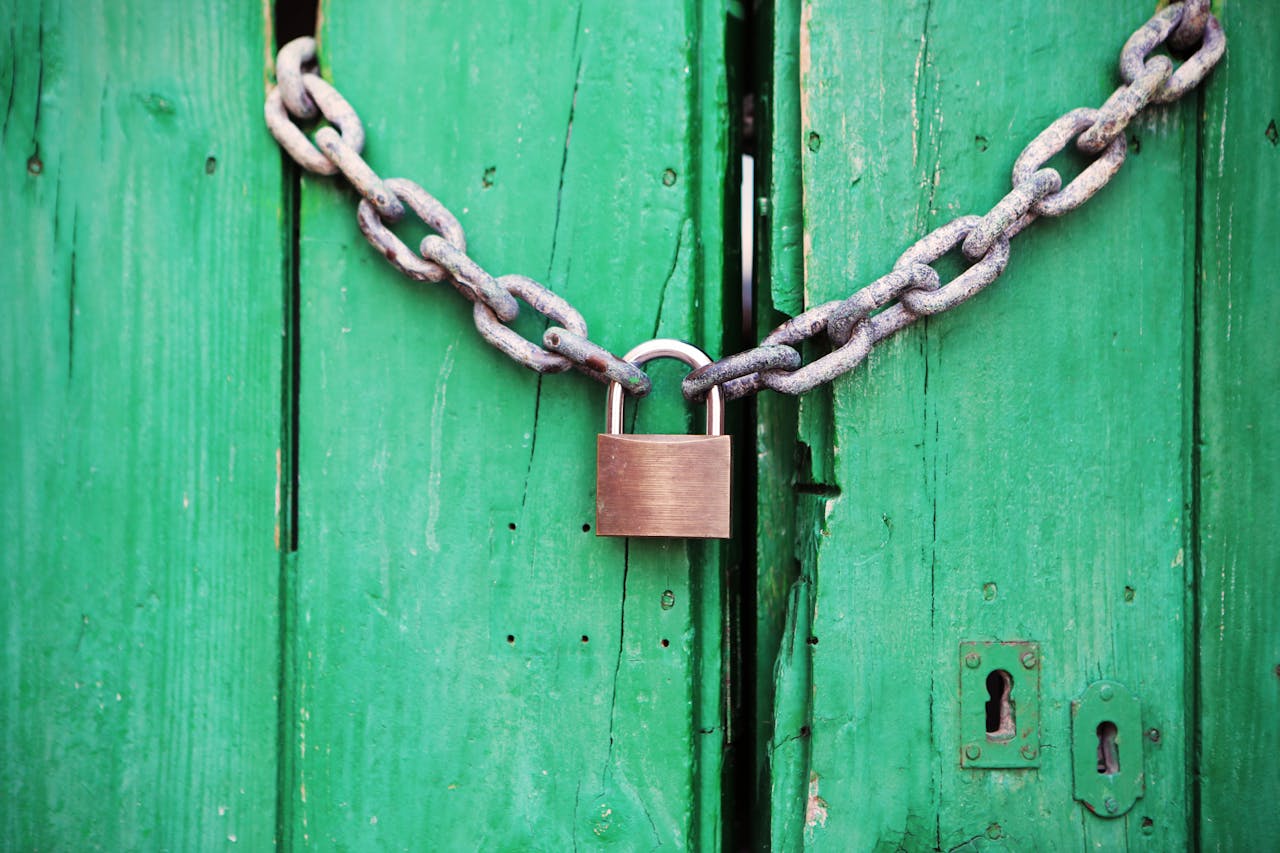 Doors locked with a chain and a padlock