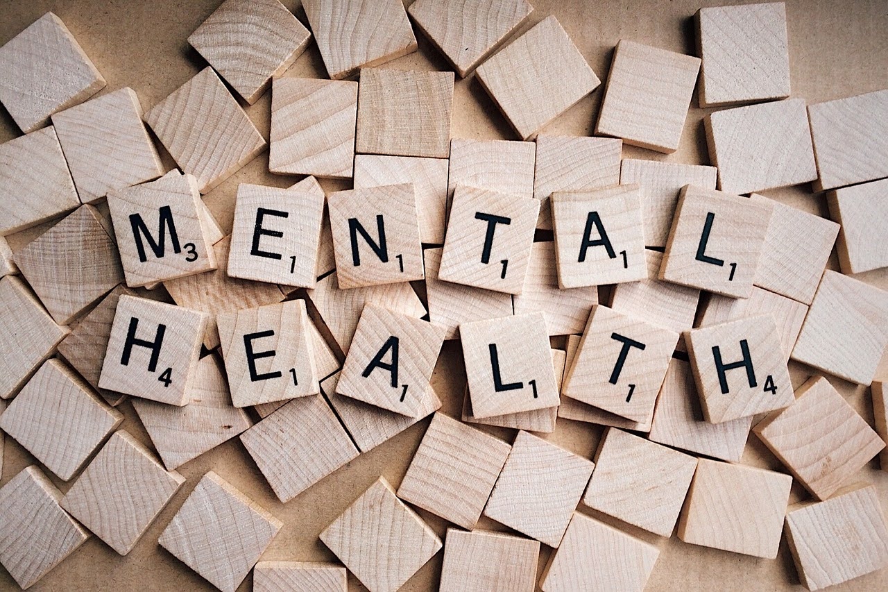 Scrabble tiles that form the words Mental Health