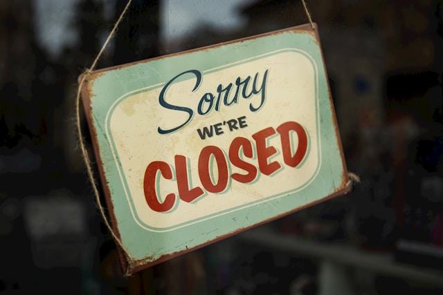 Shop sign that says sorry we're closed"
