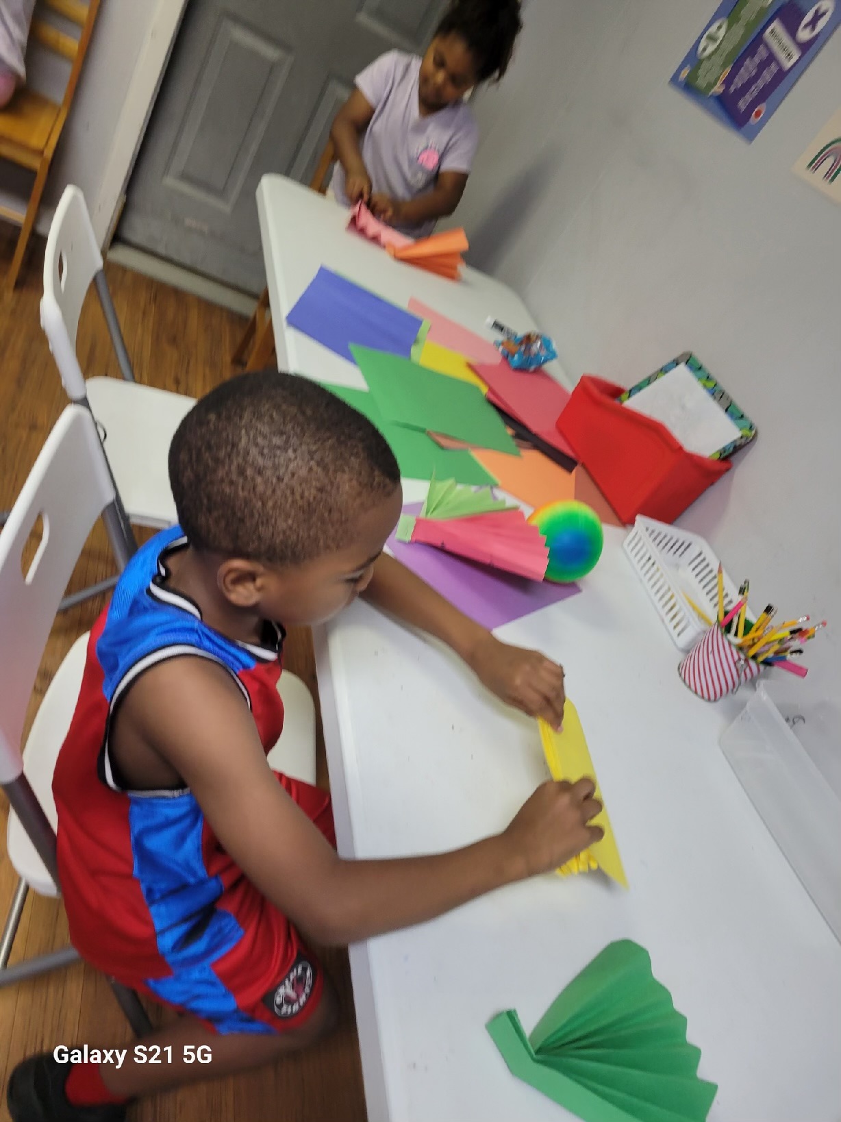 Summer 2023 Fun and Creativity at Our Tutoring Program: Students Delight in Making Colorful Paper Fans!