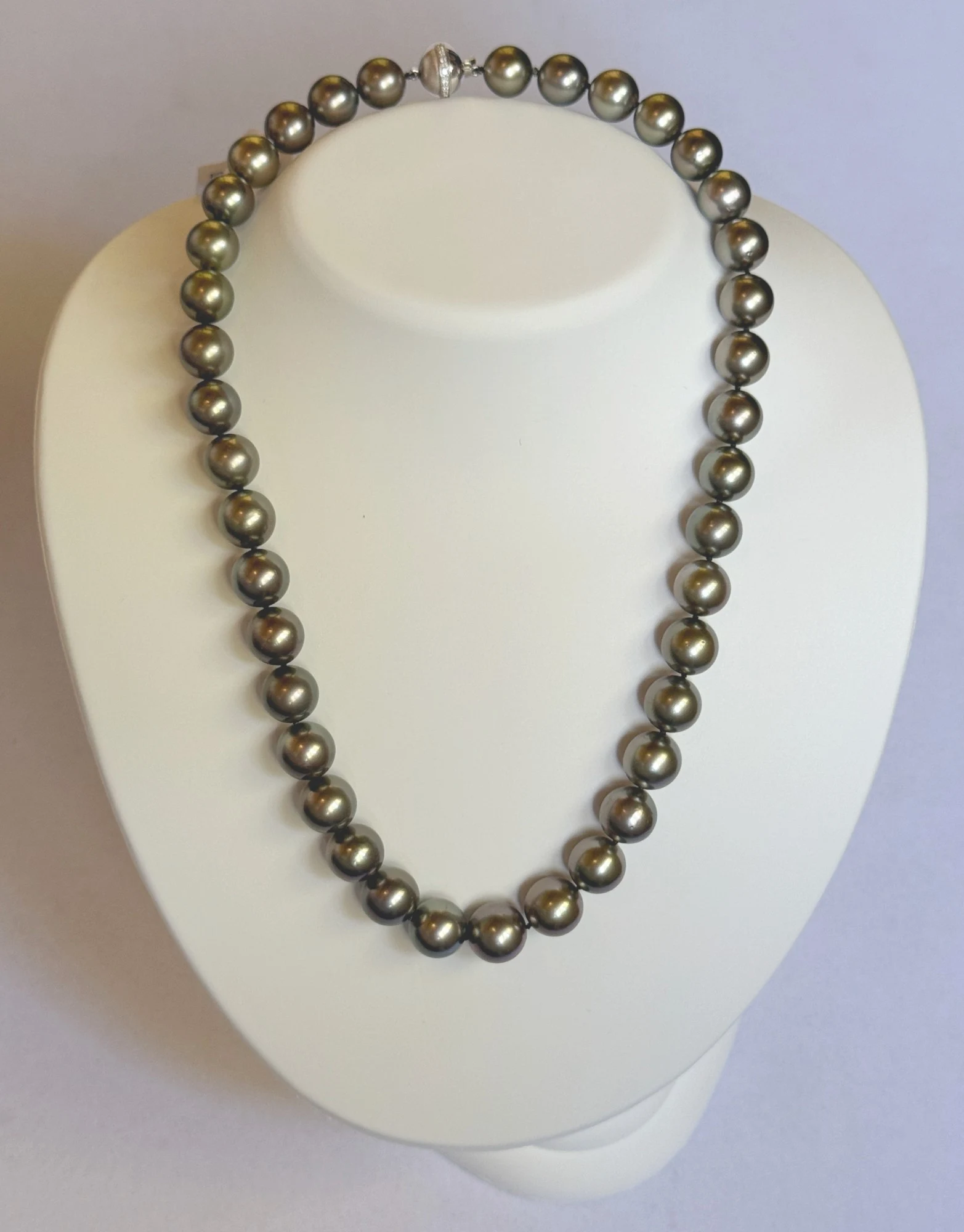 10–11.7mm Tahitian Pearl Necklace on a display bust