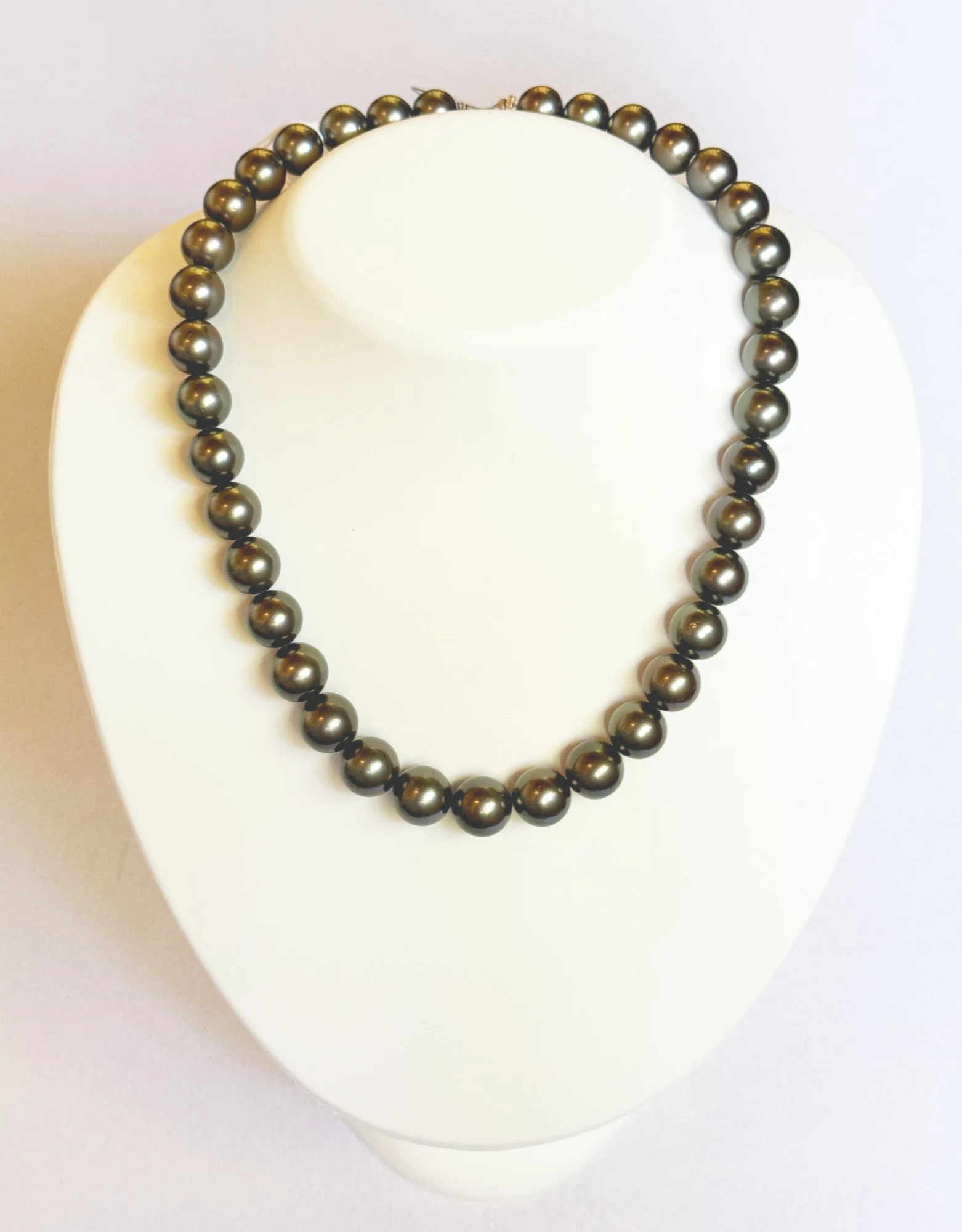 10–12mm Tahitian Pearl Necklace on a display bust