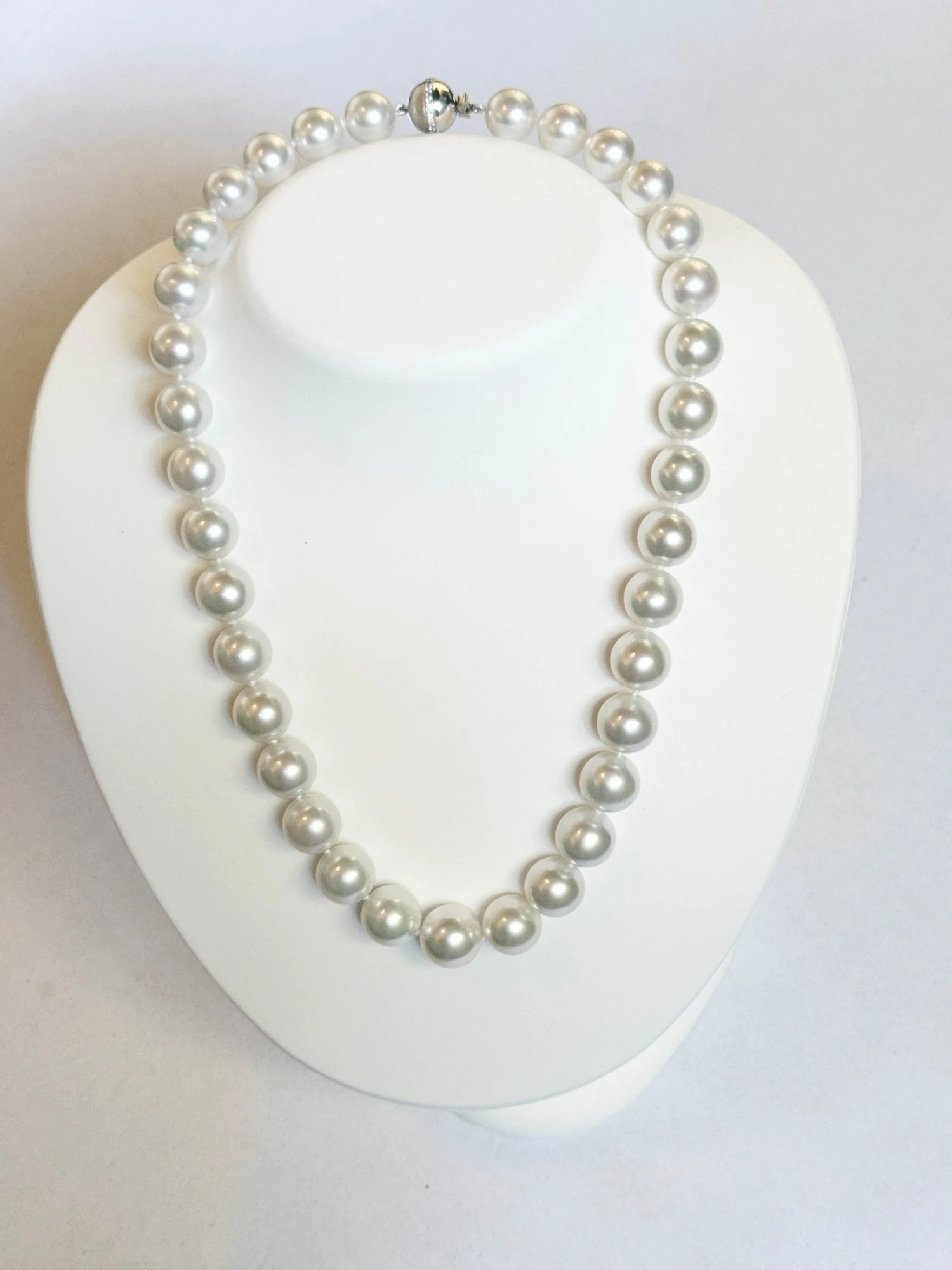 11–13.4mm White South Sea Pearl Necklace on a display bust