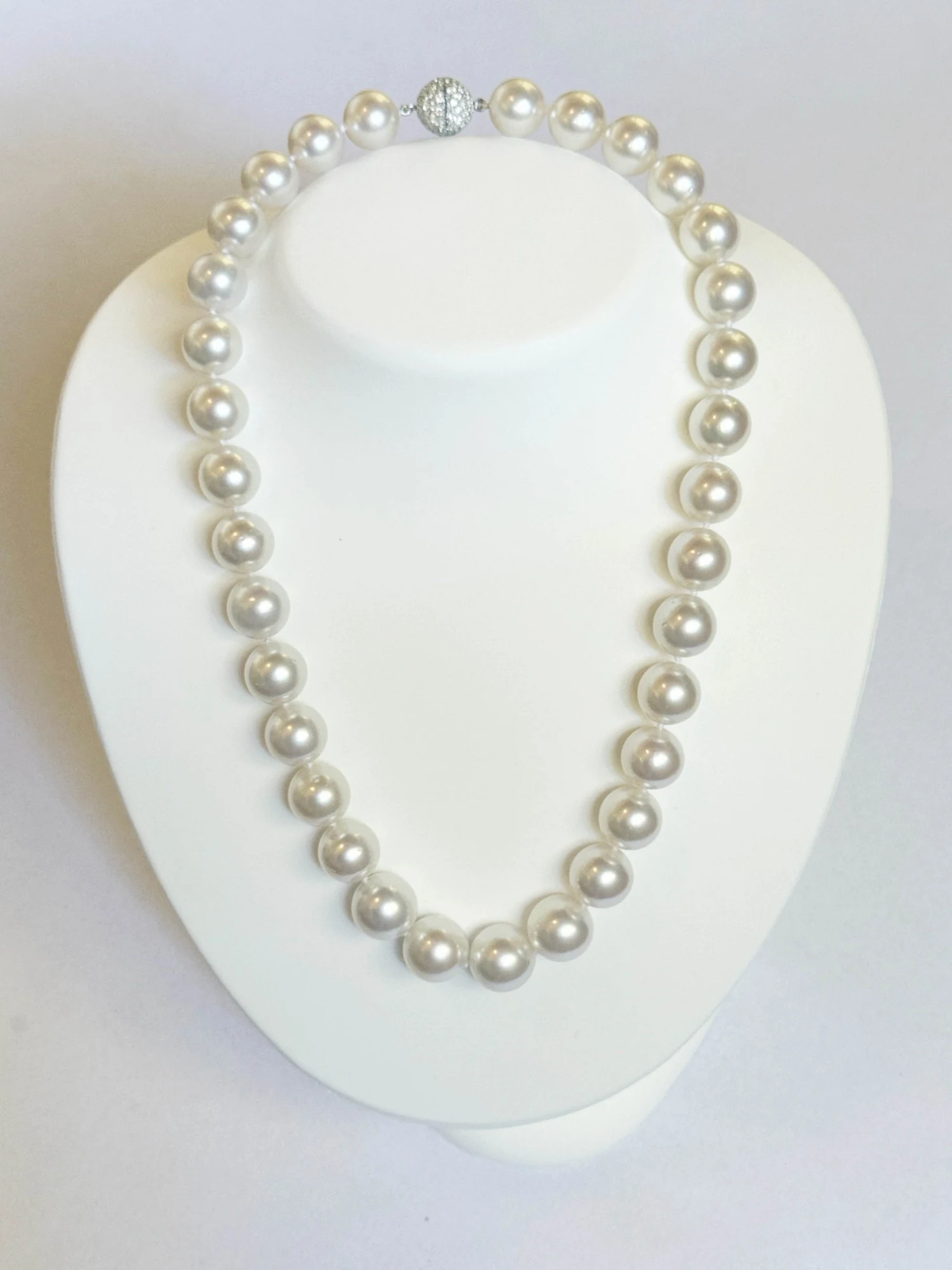 12.1–14.1mm White South Sea Pearl Necklace on a display bust