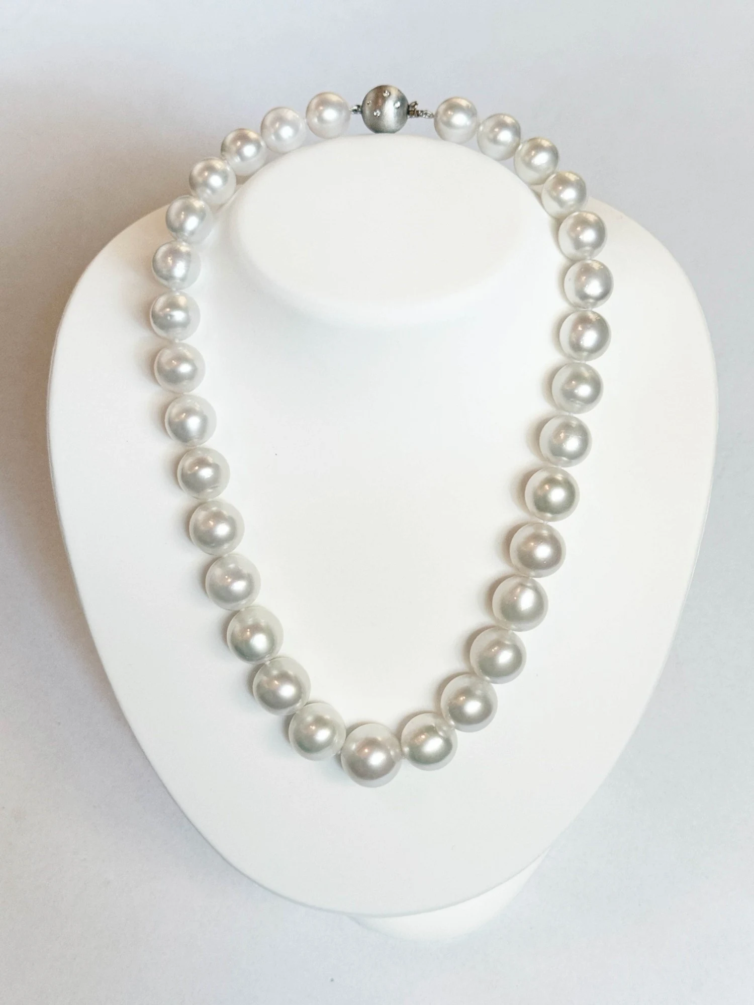 12–16.5mm White South Sea Pearl Necklace on a display bust