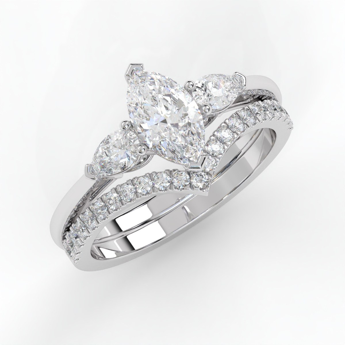 Marquise and pear-cut diamond engagement ring with a matching curved diamond wedding band in 14K white gold