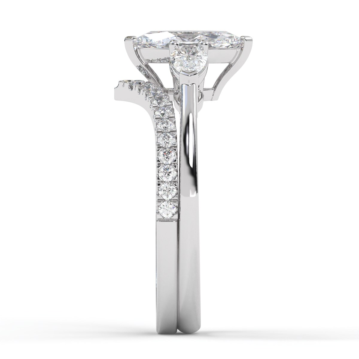 Side profile showing the curved wedding band nesting flush beneath the marquise engagement ring