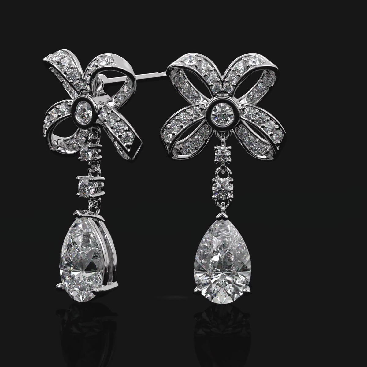 Platinum Emperor drop earrings set with matched pear diamonds