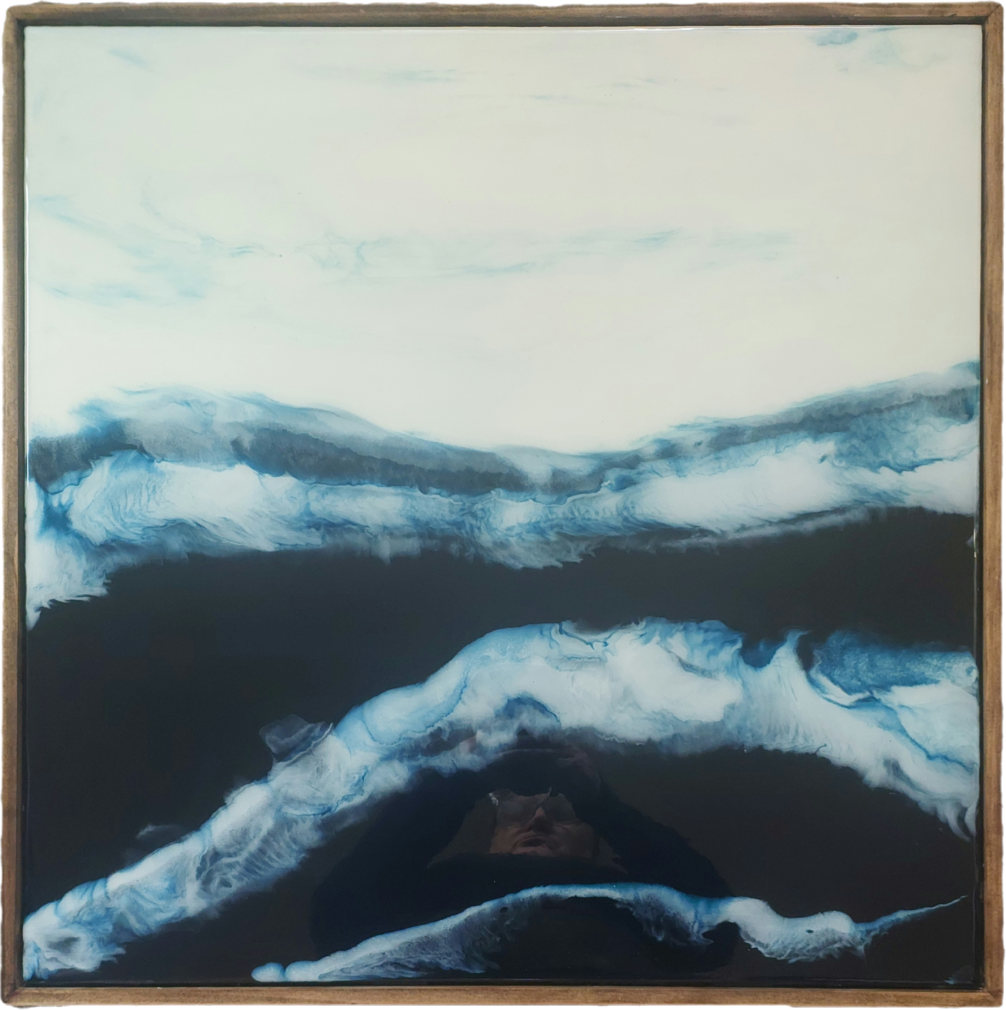 Original square ocean artwork in layered blue resin and acrylic, showing foaming waves over deep water beneath a pale horizon, framed in walnut-stained pine.