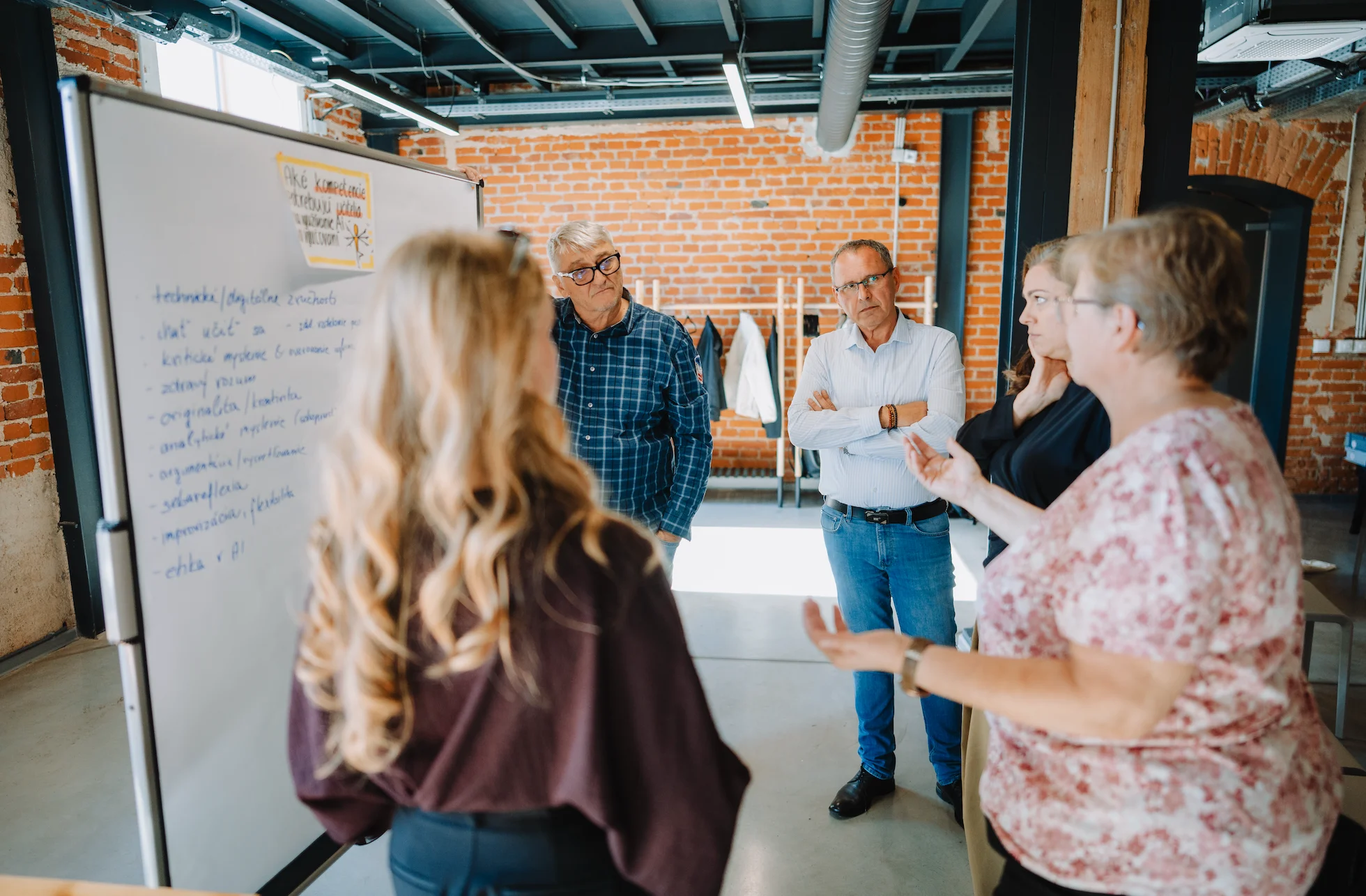AI-generated concept of adult educators discussing a lesson activity at a workshop.