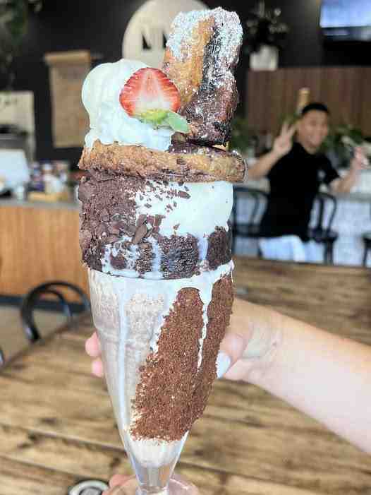 An indulgent chocolate freakshake loaded with brownies and cookies at The Nines Emporium, a standout among our limited time drinks.