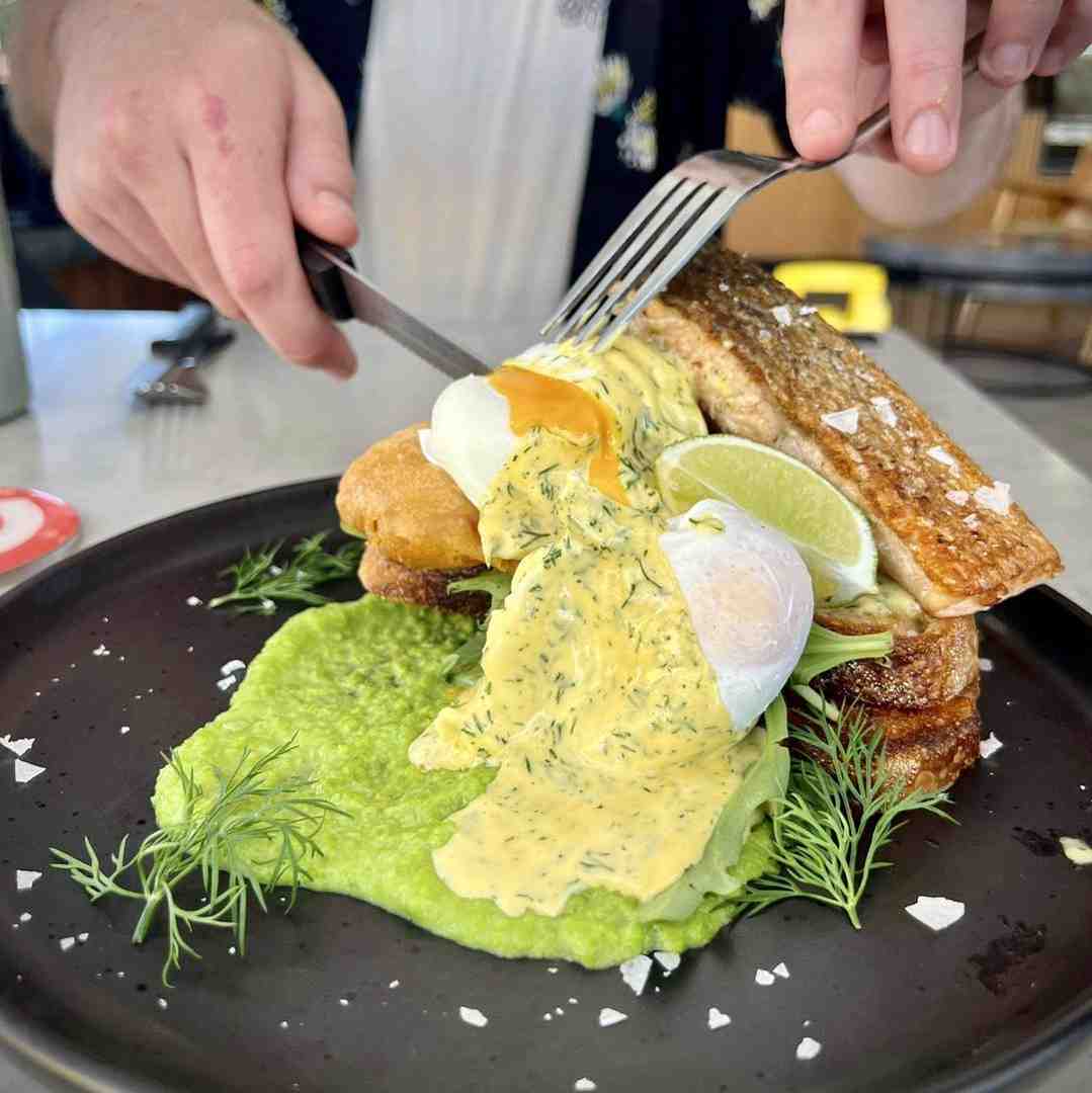 Savour the incredible flavour of this modern salmon benny, presented beautifully on a black plate with avocado. Great food from cafes in Maroochydore. Savour the incredible flavour of this modern salmon benny, presented beautifully on a black plate with avocado. Great food from cafes in Maroochydore.