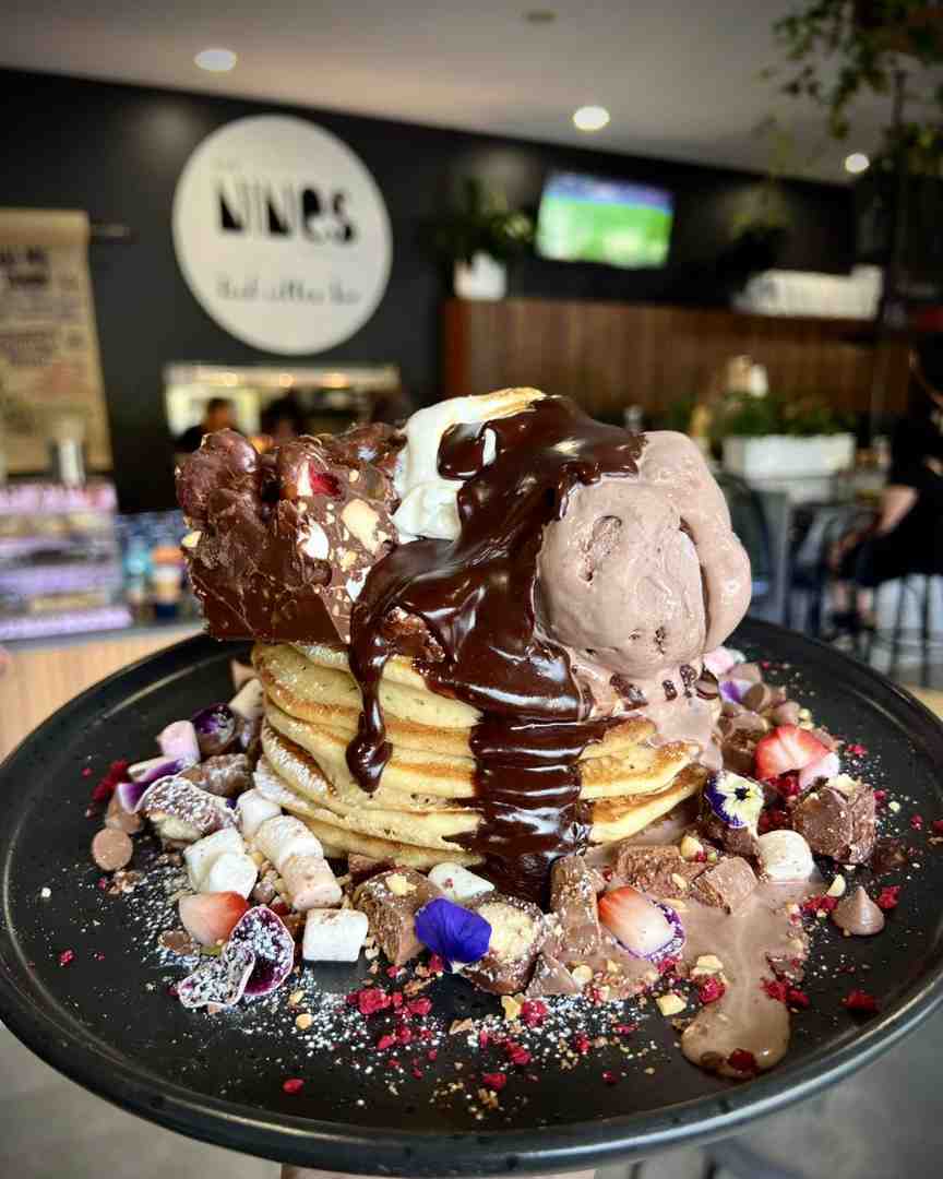 One of The Nines' monthly specials, a chocolate-smothered rocky road pancake stack. The ultimate sweet feed when looking for the best lunch Sunshine Coast. One of The Nines' monthly specials, a chocolate-smothered rocky road pancake stack. The ultimate sweet feed when looking for the best lunch Sunshine Coast.