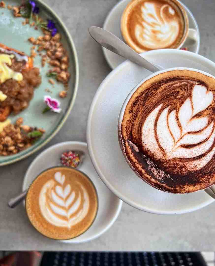 a barista-made coffee with latte art at the Nines - great place for breakfast