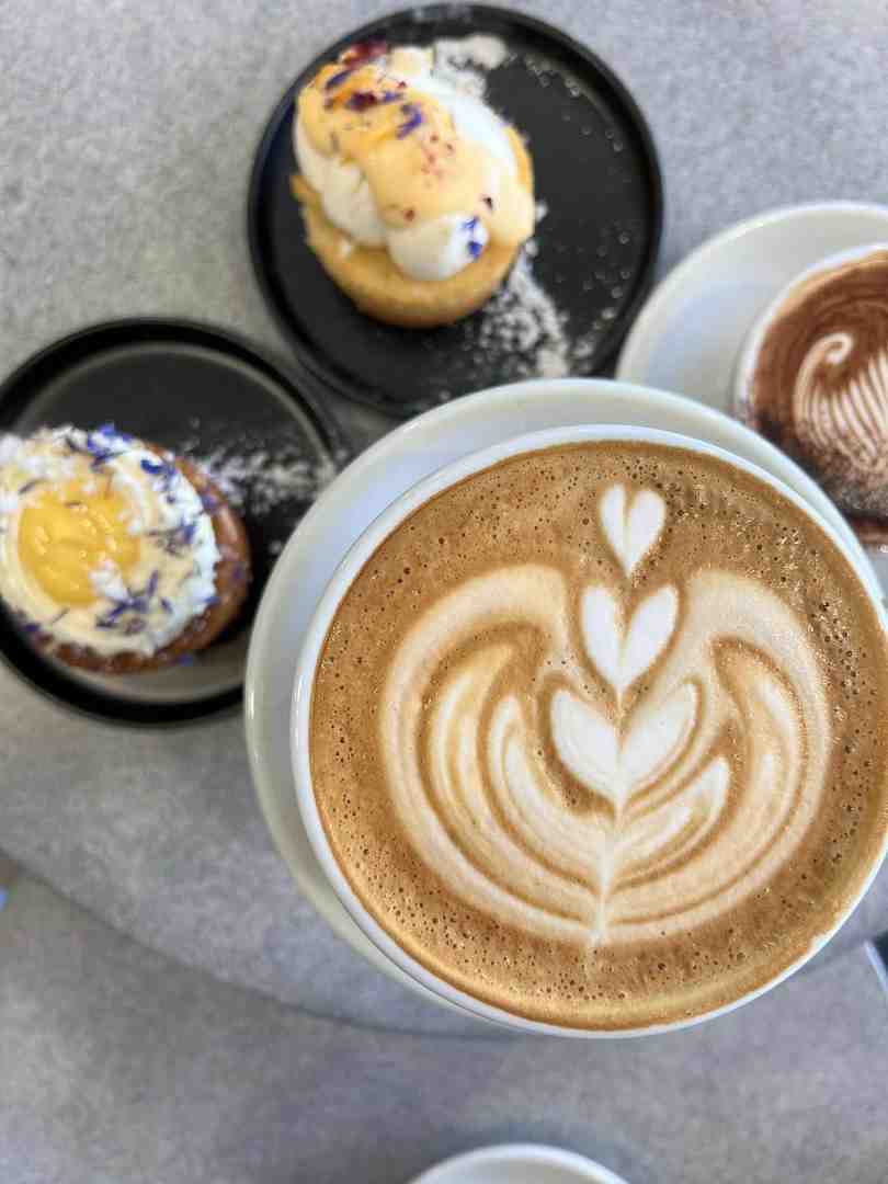coffee with latte art on an outdoor table - Alfresco dining options in Maroochydore coffee with latte art on an outdoor table - Alfresco dining options in Maroochydore