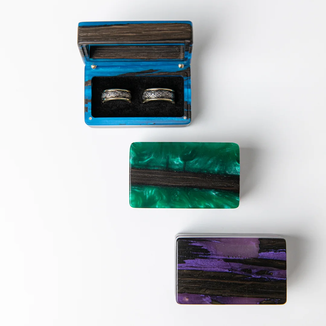 user-inserted Handcrafted epoxy resin ring box with wood grain and colored resin inlay.