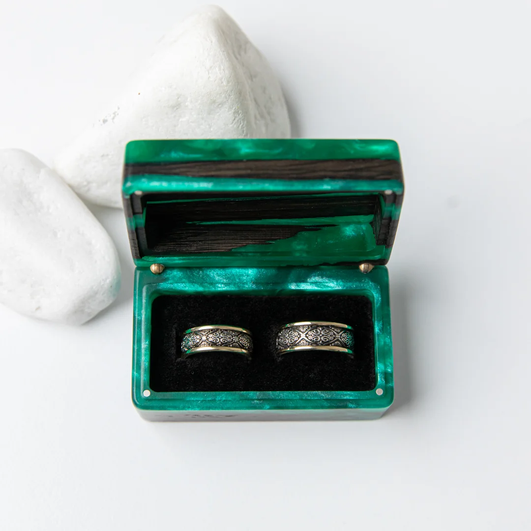 handcrafted wooden ring box in pocket