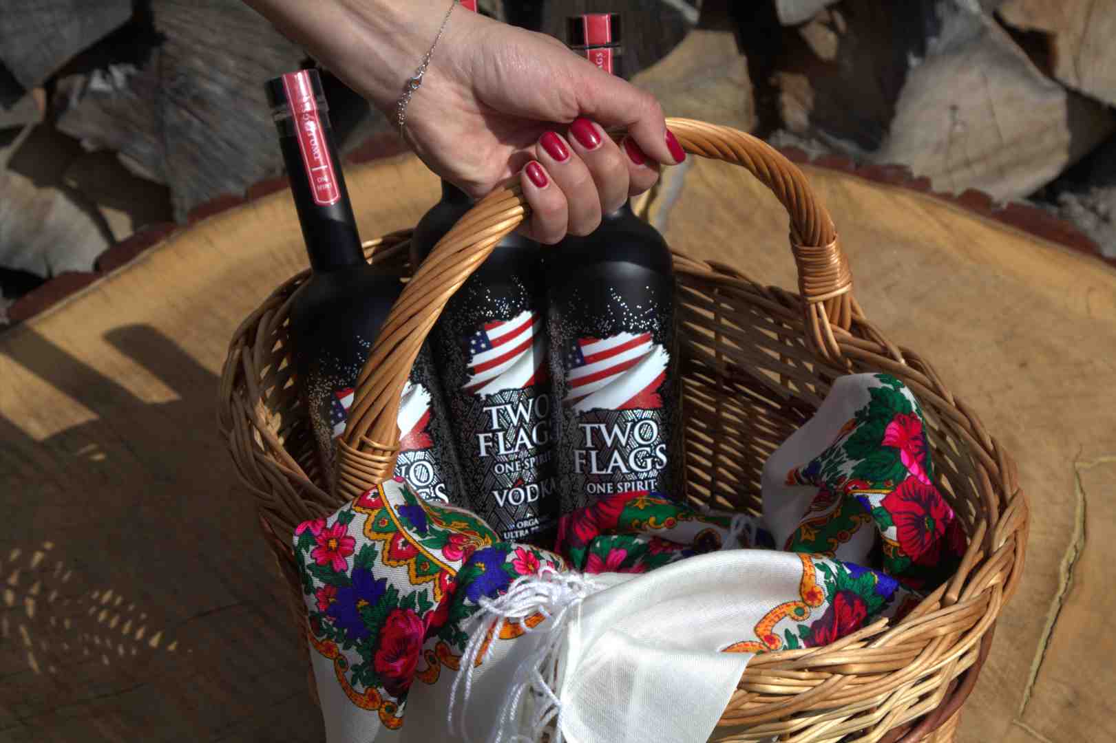 Two Flags One Spirit vodka bottle next to a tasting glass showing viscosity or 'legs' - Best vodka neat?