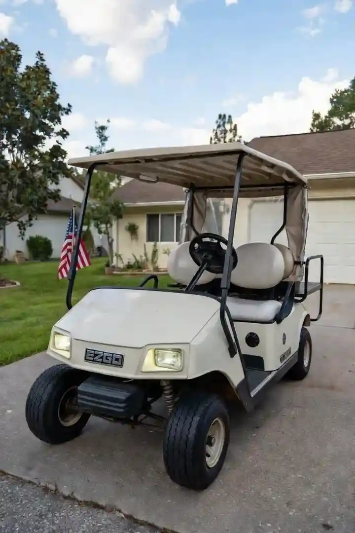 EZGO TXT golf cart in driveway - EZGO TXT AC conversion