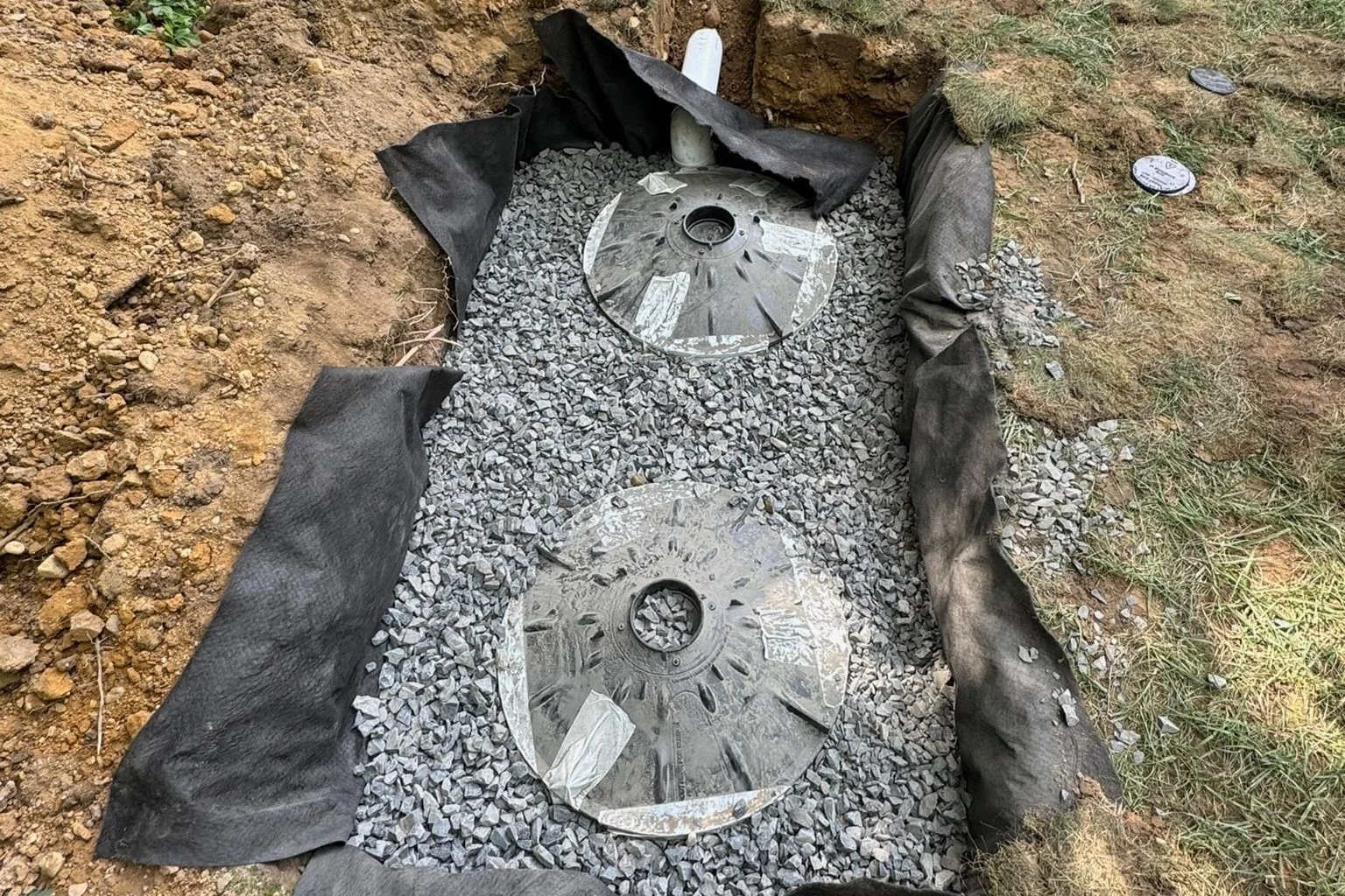 user-inserted Outdoor dry well installation for perimeter drainage in NJ homes.
