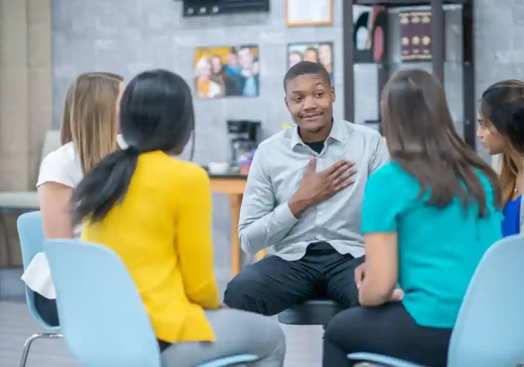 Diverse individuals in a supportive group therapy setting - 28 day rehabs near me Diverse individuals in a supportive group therapy setting - 28 day rehabs near me
