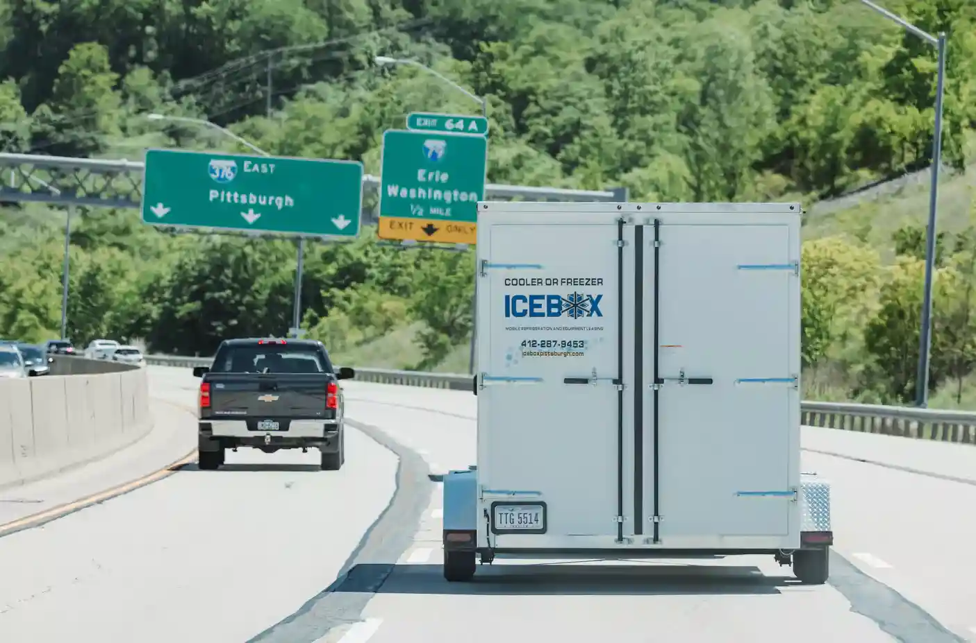 person checking digital temperature display on a mobile refrigeration unit - chilled storage