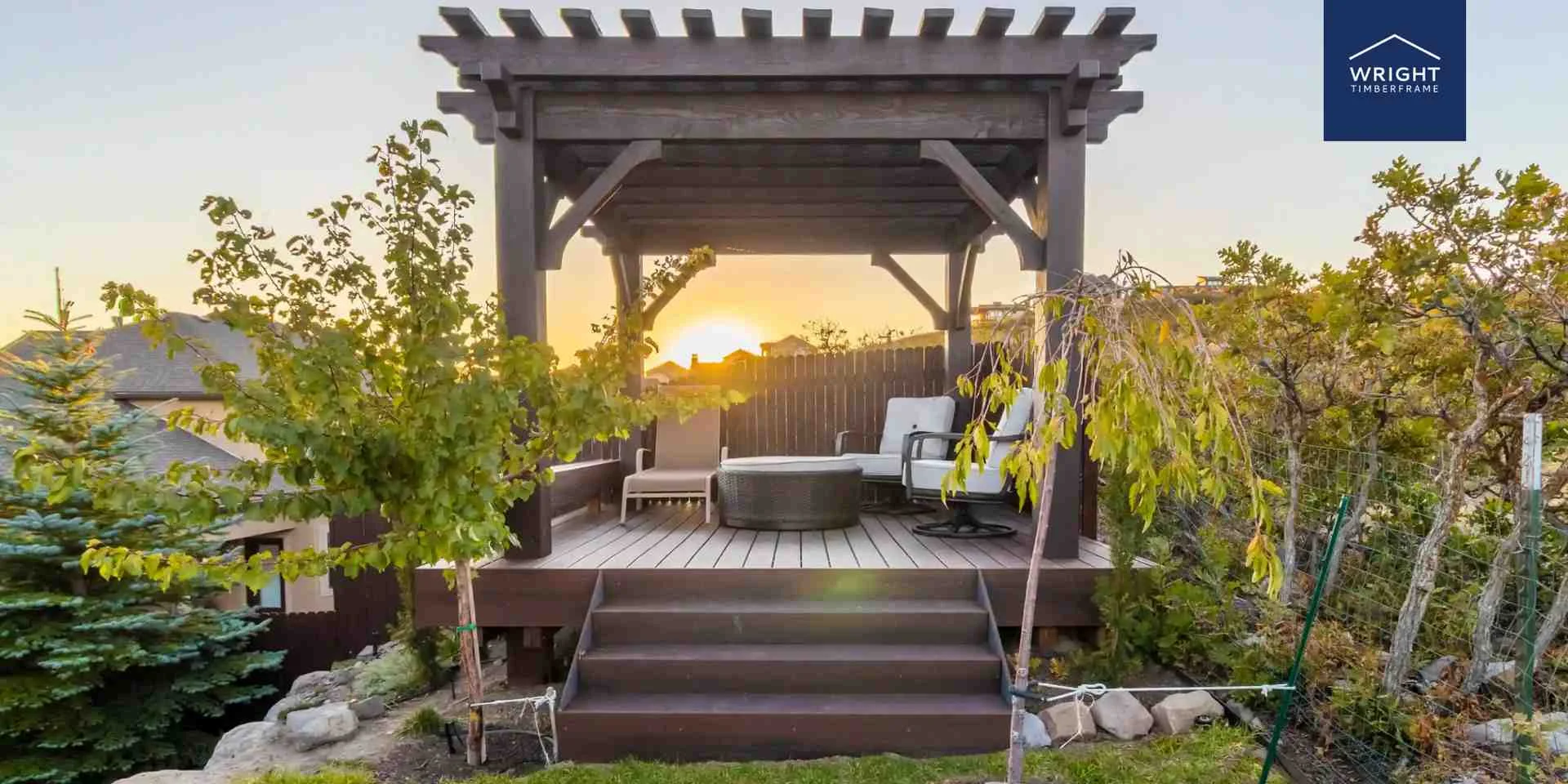 Backyard Timber Frame Pergola Outdoor Space Timber frame pergola kits backyard installation showing raised deck pergola with seating area, steps, and landscaped garden at sunset