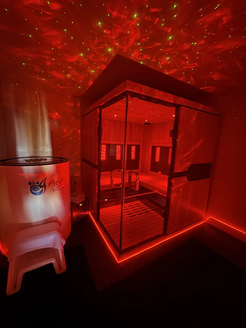 Agni Miami Sanctuary ice bath beside a red-lit infrared sauna