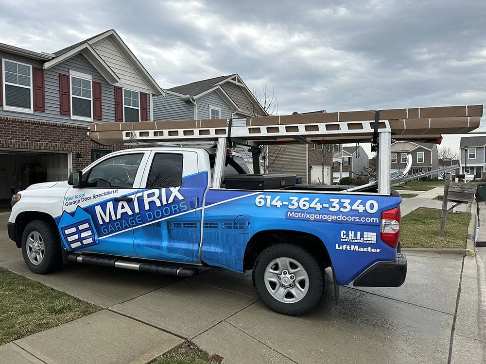 Family-owned service truck in a Columbus neighborhood - local garage door experts