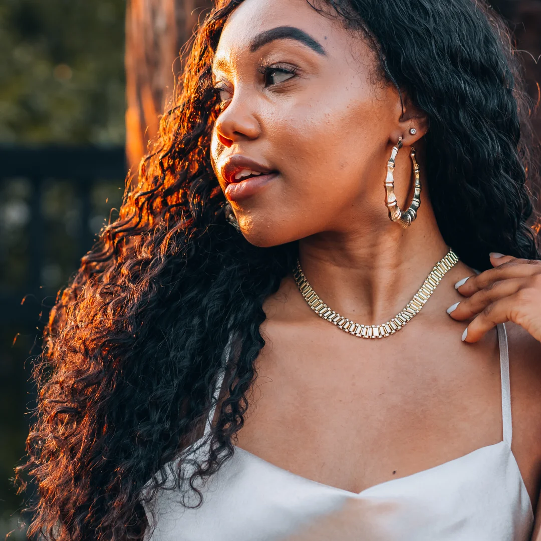 Classic gold stud earrings and hoop earrings side-by-side Classic gold stud earrings and hoop earrings side-by-side