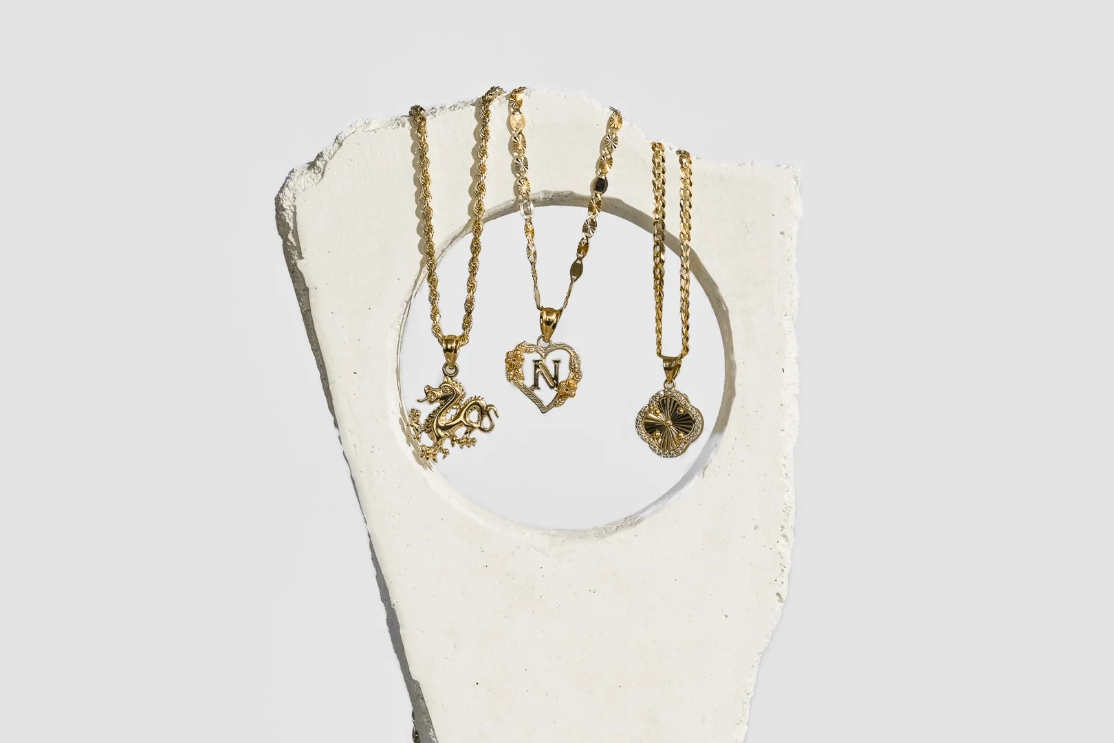 assortment of gold charms and pendants