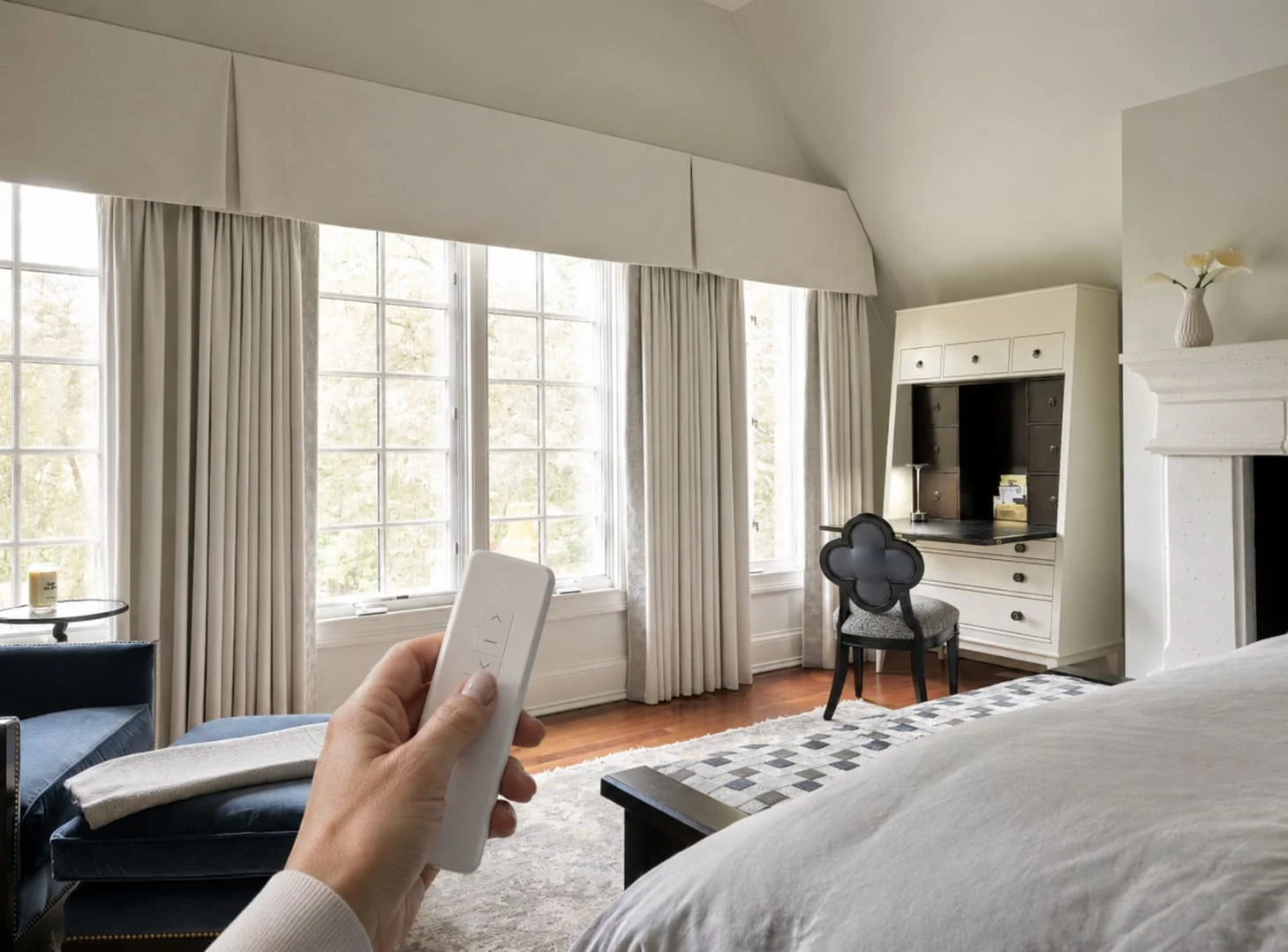 Motorized bedroom blackout curtains in Downers Grove home, controlled by remote for automated light control and energy efficiency. Motorized bedroom blackout curtains in Downers Grove home, controlled by remote for automated light control and energy efficiency.