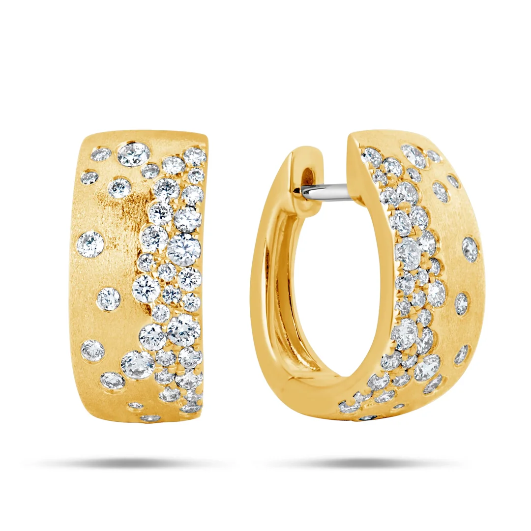Assorted yellow gold huggie hoops, studs, and textured drop earrings Assorted yellow gold huggie hoops, studs, and textured drop earrings