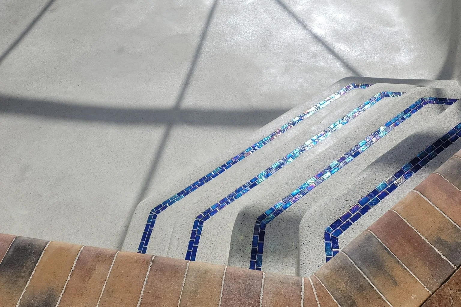 Freshly resurfaced pool with new plaster, showcasing a key aspect of pool remodels.