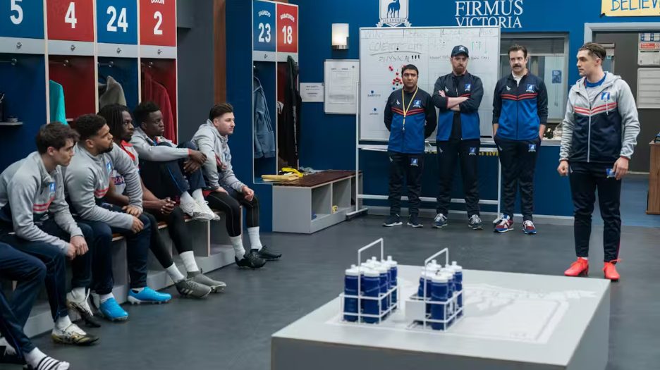 Ted Lasso And His Afc Richmond Players In The Dressing Room. Courtesy Of Apple Tv. Ted Lasso Management Lessons. Ted Lasso And His Afc Richmond Players In The Dressing Room. Courtesy Of Apple Tv. Ted Lasso Management Lessons.