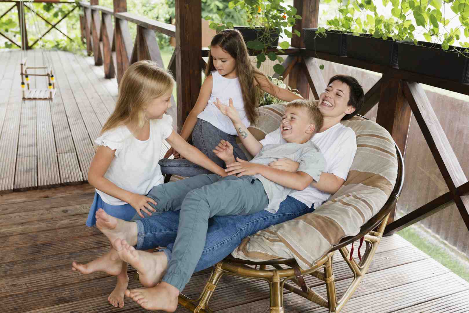 happy family enjoying barbecue on newly stained deck - deck staining springfield happy family enjoying barbecue on newly stained deck - deck staining springfield