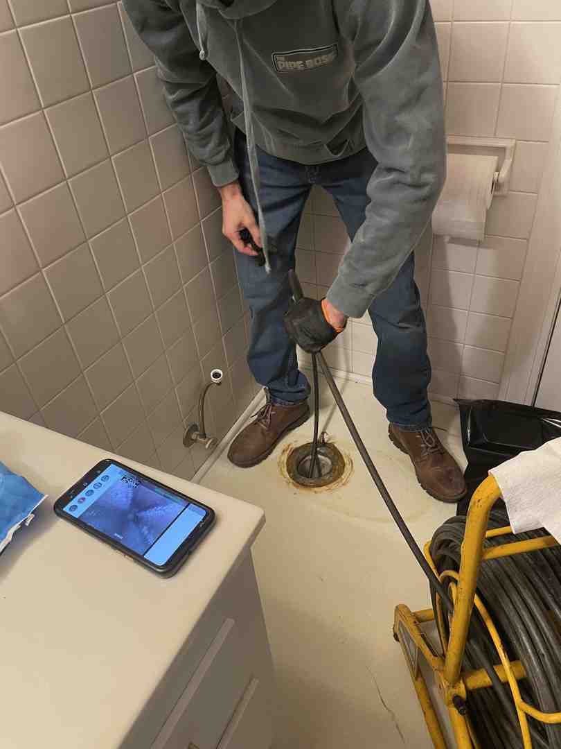 Pipe Boss camera monitor displaying tree root intrusion inside a pipe - plumbers near me with cameras