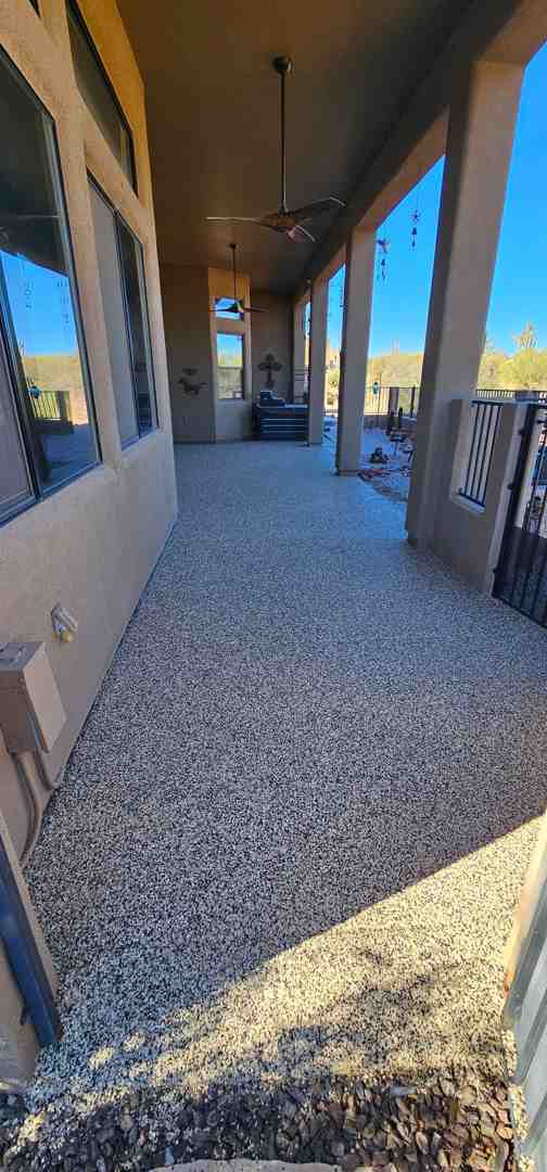 Happy family enjoying their beautifully coated, safe concrete patio