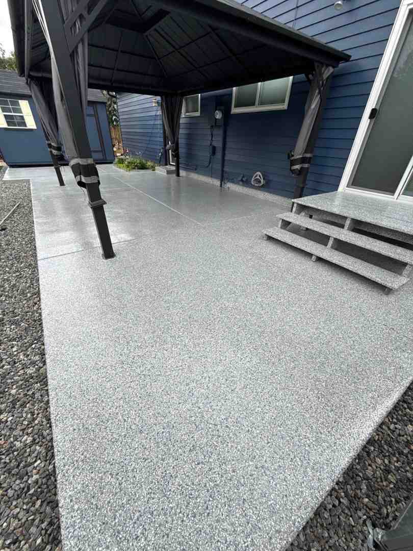 A finished, high-gloss polyaspartic garage floor in a Denver home, showcasing its durability and aesthetic appeal. A finished, high-gloss polyaspartic garage floor in a Denver home, showcasing its durability and aesthetic appeal.