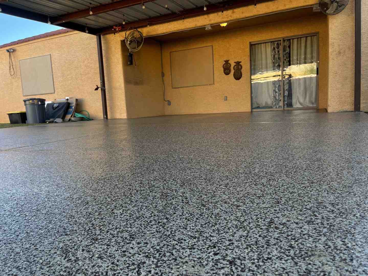 A finished polyaspartic patio floor in a Phoenix backyard, gleaming under the sun with no yellowing. - concrete coatings near me A finished polyaspartic patio floor in a Phoenix backyard, gleaming under the sun with no yellowing. - concrete coatings near me