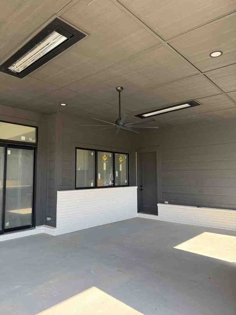 A wall-mounted electric heater seamlessly integrated into a covered porch design in Southport, IN. - Indianapolis outdoor heater