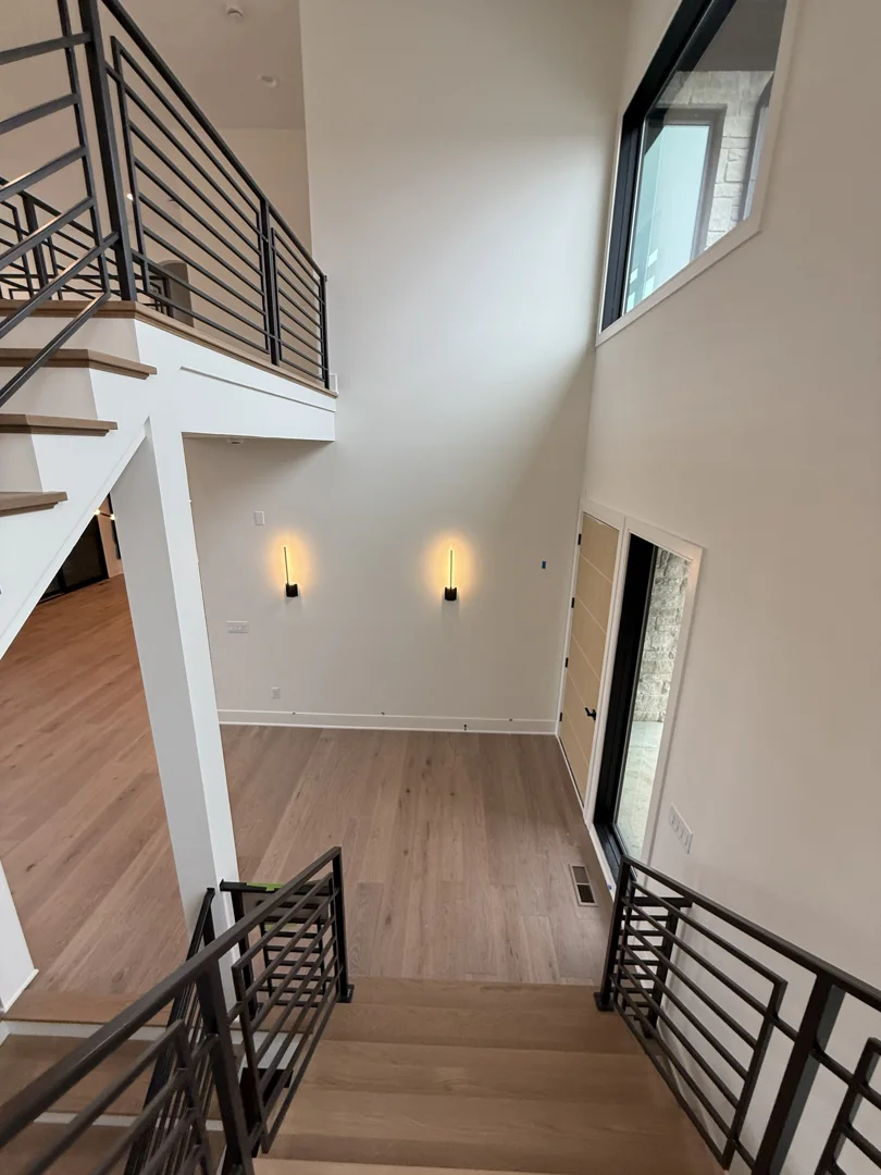 Automated Lutron shades in a luxury living room integrated with RadioRA 3 - Lutron Certified Installers in Indiana