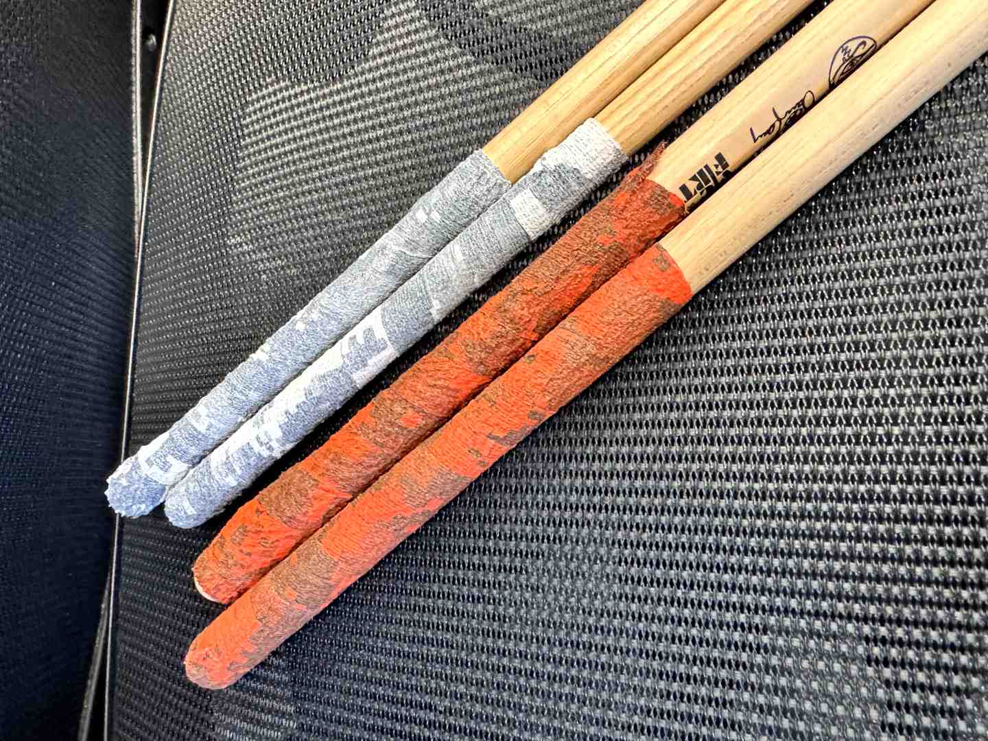 SHIELD drum stick grip tape in different colors - arctic white and bright orange camo
