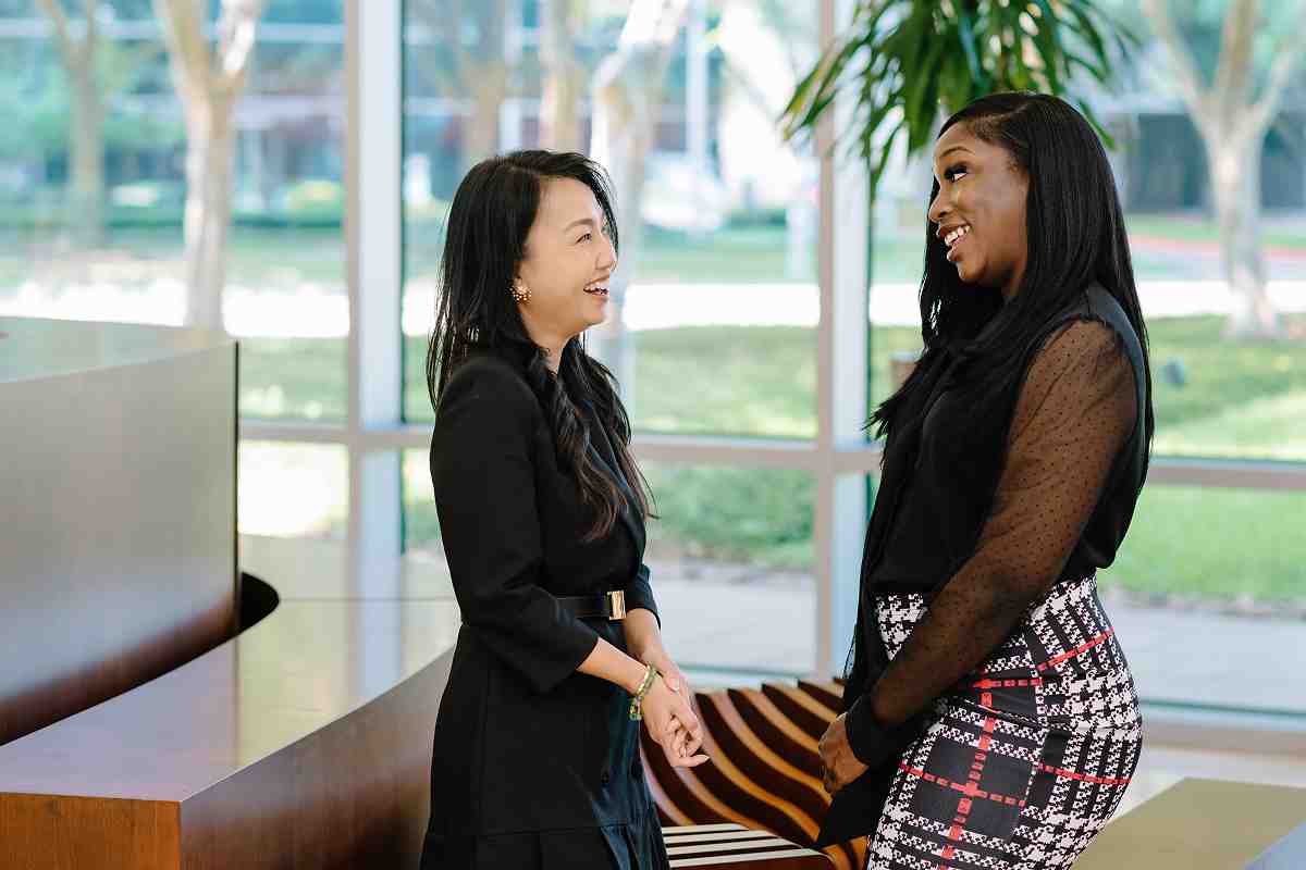 Two partners signing a formal partnership agreement with a lawyer observing - Partnership Dispute & Fiduciary Duty Lawyer