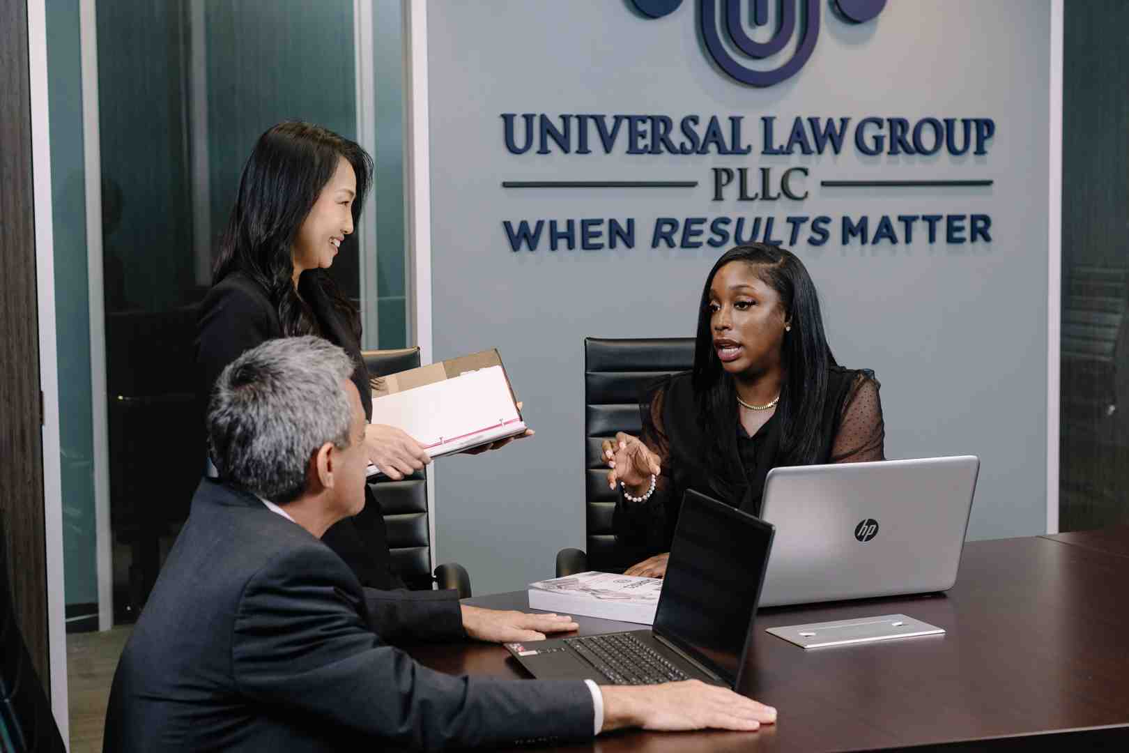 attorneys in a conference room discussing an unlawful death lawsuit