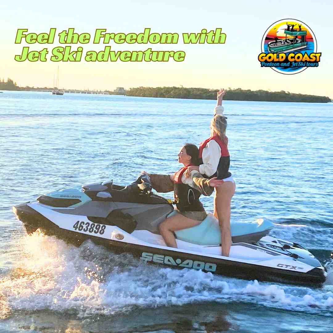 A woman drives a jet ski as her passenger stands up and raises her arms in the air, showing a sense of freedom and fun - how to jet ski for beginners